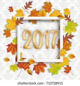 Autumn foliage with white frame and numbers 2017 on the wallpaper with ornaments. Eps 10 vector file.