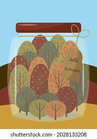 Autumn forest in a glass jar. The inscription hello autumn