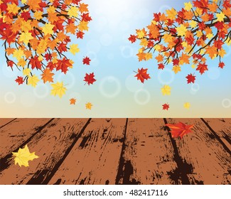 Autumn frame with maple leaves and grunge wooden table in perspective