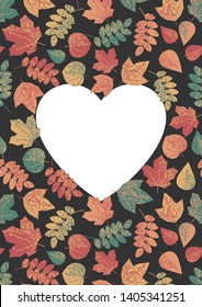 Autumn frame with white heart on a black background with autumn leaves