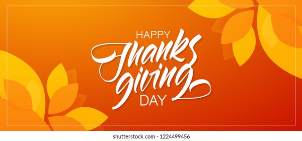 Autumn greeting banner with hand lettering composition of Happy Thanksgiving Day and fall leaves on orange background.