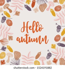 Autumn greeting card with colorful mushrooms, acorns, leaves, branches, wood on beige background. Floral frame in scandinavian style. Perfect for seasonal invitation