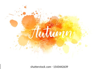 Autumn - handwritten modern calligraphy lettering on abstract watercolor splash with abstract leaves. Season illustration. Orange and yellow colored.