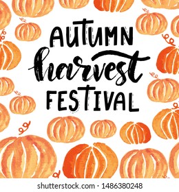 Autumn harvest festival hand lettering phrase on orange watercolor pumpkin background