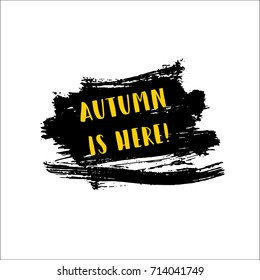 Autumn is here greeting banner vector graffiti isolated. Hipster label with hand painted watercolor brush splashes and text. Autumn is here lettering on a smear, autumn banner with painted background.