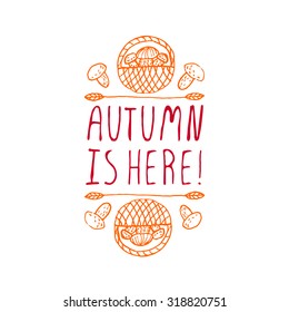 Autumn is here. Hand-sketched typographic element with mushrooms on white background. 