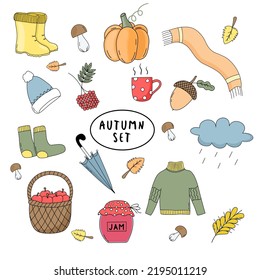 Autumn items set: pumpkin, rubber boots, apple basket, jam, sweater, socks, hat, acorn, scarf.