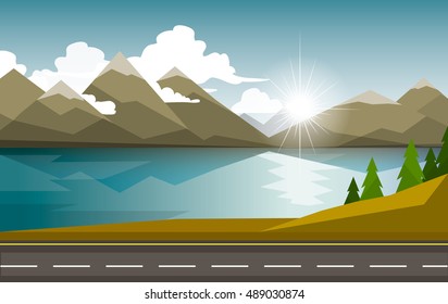 The autumn landscape of forests, mountains, road and lake.