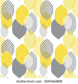 Autumn leaf fall. Seamless modern pattern with abstract leaves for textiles and paper. The trend colors of 2021 are yellow and gray. Vector.