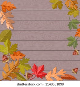 Autumn leaf on brown wood.