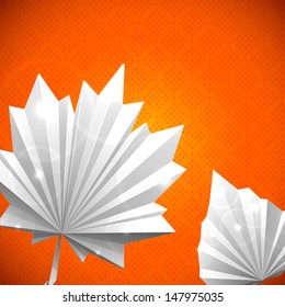 Autumn leaf origami set. The folded white paper on a orange background. Glowing stars and stripes in the background.