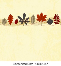 Autumn leaf ornament on the light grunge background.