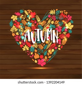 Autumn leaf poster. Orange leaves of maple, september foliage , placed in frame with text Autumn for fall nature season greeting card or banner design.