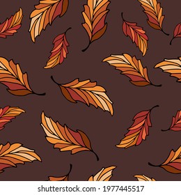 Autumn leafy pattern with yellowing leaves on a brown background. Seamless background with leaves in natural earthy tones. Autumn pattern with bright vector leaves. Autumn pattern of hand drawn doodle