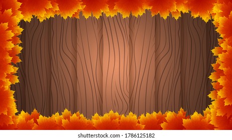 Autumn leaves around a wooden background