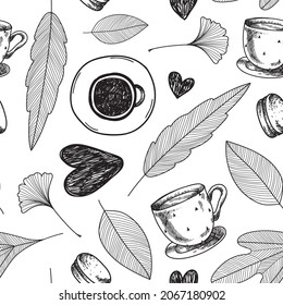 Autumn leaves and coffee seamless pattern. Hand drawn illustration with cup of hot drink, hearts.