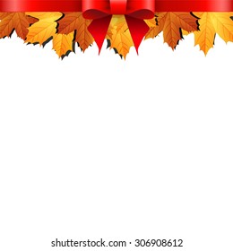 Autumn leaves decorated with red bow