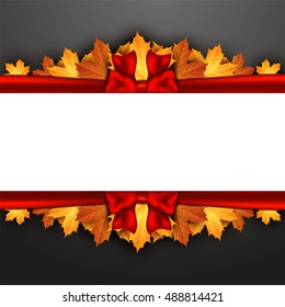 Autumn leaves decorated with a red bow on a blackboard. Autumn banner.