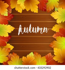 Autumn leaves frame on wood background.Vector