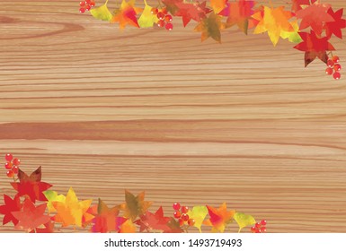 Autumn leaves frameA wood grain background