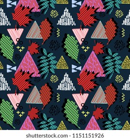 Autumn leaves with geometric triangle memphis style seamless pattern.