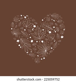 Autumn leaves in heart shaped design white outlines on brown