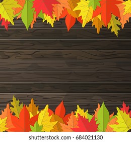 autumn leaves on wooden plank background