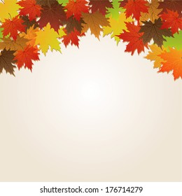Autumn leaves over paper background with copy space 