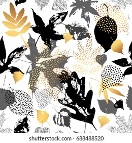 Autumn leaves seamless pattern. Hand drawn leaf silhouettes with doodle, grunge, scribble textures. Natural elements in golden, monochrome colors, background for fall design. Vector illustration