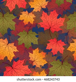 Autumn leaves, seamless pattern, vector background. Red, yellow and green maple leaves on a blue background. For the design of wallpaper, fabric, decoration material