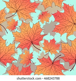 Autumn leaves, seamless pattern, vector background. Yellow orange maple leaf on a blue background. For the design of wallpaper, fabric, decoration material