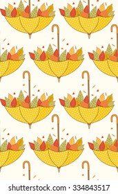 Autumn leaves seamless pattern with yellow polka dots open umbrellas on beige background