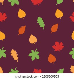 Autumn leaves. Simple seamless pattern on a dark background.

