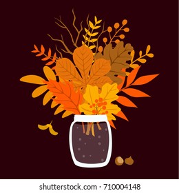 autumn leaves and twigs in jar 