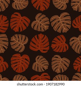 Herbstmonsterablattmuster. Nahtloses Design aus großen braunen Pflanzenblättern. Muster für ein Banner, Textilien. Die Idee eines Herbstwaldes.