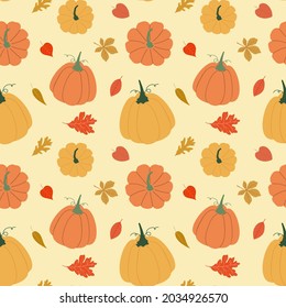 Autumn orange pumpkins with fallen leaves on yellow background vector seamless pattern.