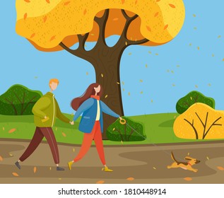 Autumn park, yellow trees, bushes, falling leaves, young warmly dressed couple walking cheerful little dog on leash. Happy pet. Woman and man are holding hands. Family in various weather conditions