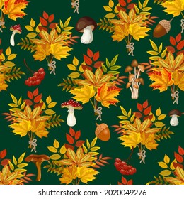 Autumn pattern with beautiful leaves.Autumn leaves, mushrooms and berries on a colored background in a vector pattern.