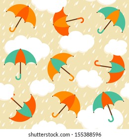 Autumn pattern with colorful umbrellas and rain. Seamless vector background.