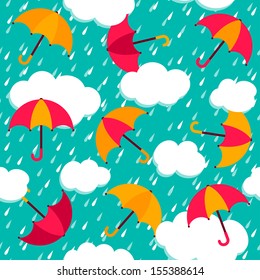 Autumn pattern with colorful umbrellas and rain. Seamless vector background.