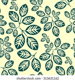 Autumn pattern with green leaves on light yellow background, seamless autumn pattern