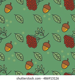 Autumn pattern with nuts, leaves, kalina on a green background.