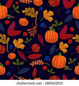 autumn pattern on a dark background. pumpkins and leaf.