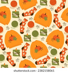 Autumn print for textile, wrapping paper, and web. Cozy autumn seamless pattern. Harvest season. Sweater, falling leaves, tea, pumpkins, socks and candles. Cozy vector illustration. Thanksgiving day.