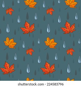 Autumn rain. Vector seamless pattern featuring maple leaves and raindrops.