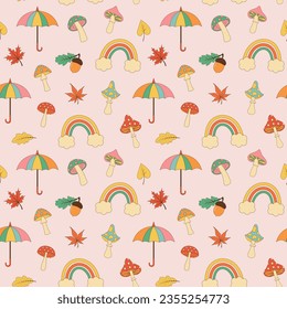 Autumn retro groovy seamless pattern. Hippie mushrooms, fall leaves, acorn, umbrella and rainbow on pastel background. 