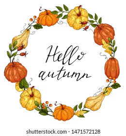 Autumn round wreath with hand drawn pumpkins, leaves and floral elements.