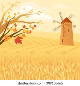 Autumn rural landscape with golden wheat fields and windmill