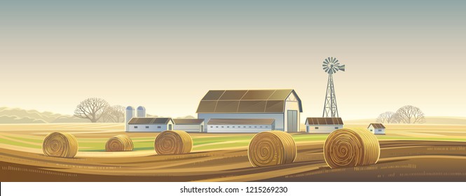 Autumn rural landscape with hay bale, and farm on the back plan.