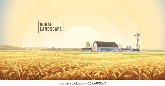 Autumn rural landscape with wheat field on the foreground and farm, on the back plan.